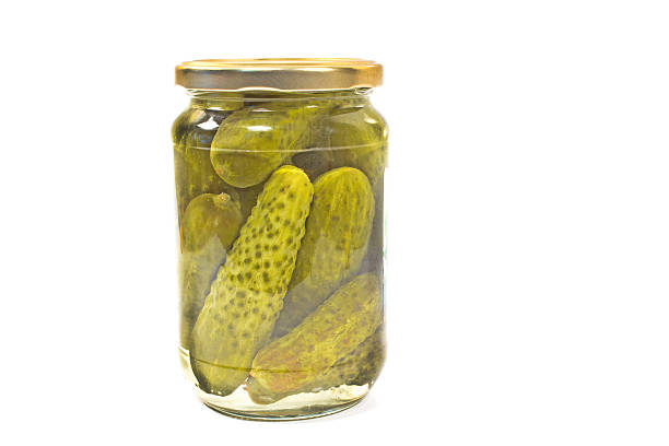 istock Pickled cucumbers in jar isolated on white 538301213