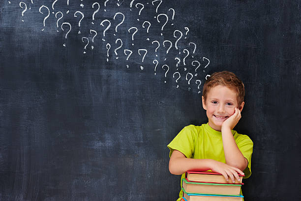 istock Hadsome cute  ginger boy holding a  pile of books 538301577