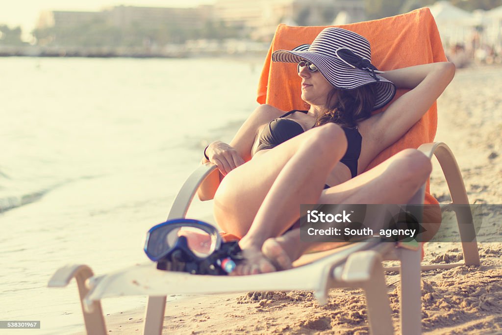 Laying on chair, sunbathing and enjoying on the beach 2015 Stock Photo