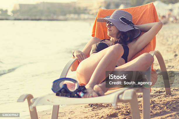 Laying On Chair Sunbathing And Enjoying On The Beach Stock Photo - Download Image Now