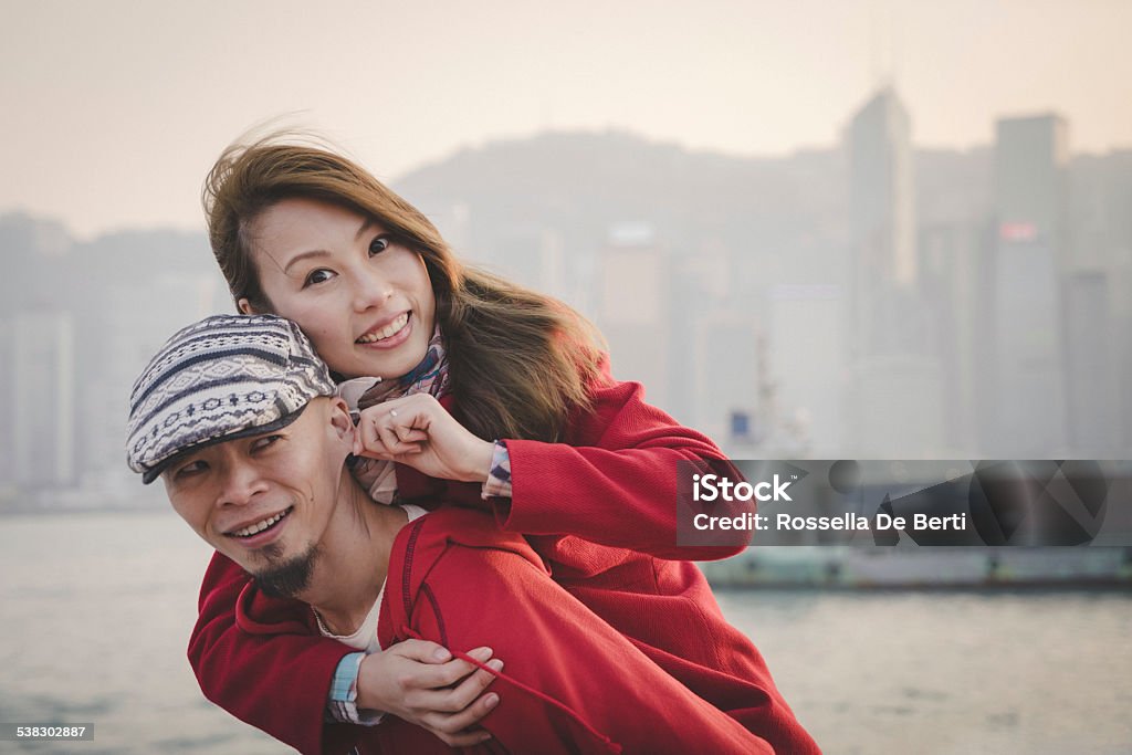 Chinese Couple Chinese couple, skyline on background. 2015 Stock Photo