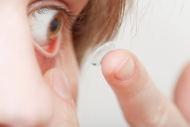 istock young woman inserting contact lens 538304055