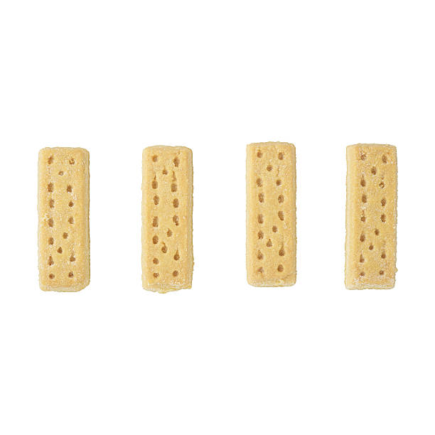 4 biscoitos amanteigados em um fundo branco. - shortbread - fotografias e filmes do acervo