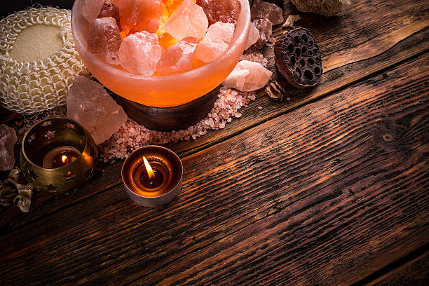 Himalayan salt lamp in orange light illuminated