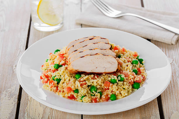 istock couscous with green peas and chicken fillet grill 538322227