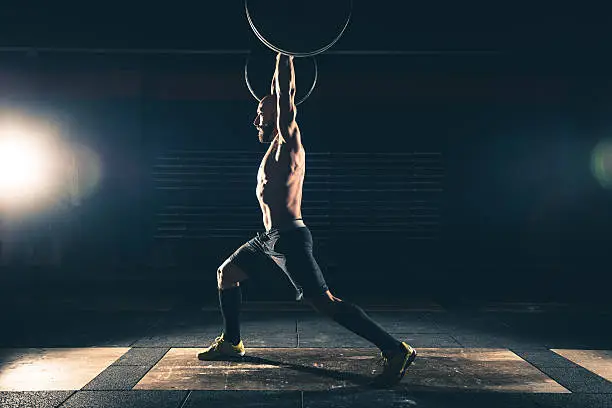 Photo of weightlifting strong man on a gym