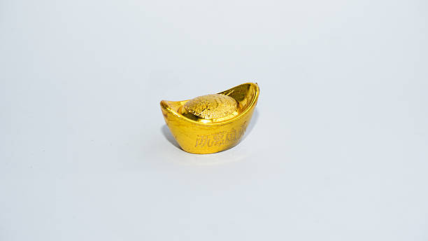 istock Shoe-shaped metal gold ingot (Yuan Bao), China 20th currency 538324625