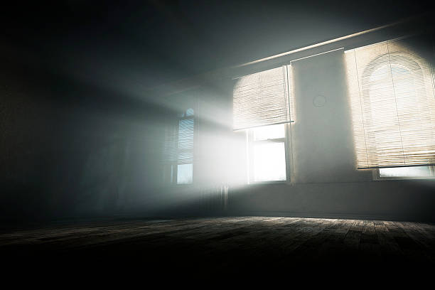 spooky empty room with mysterious light beams - harabe fotoğraflar stok fotoğraflar ve resimler