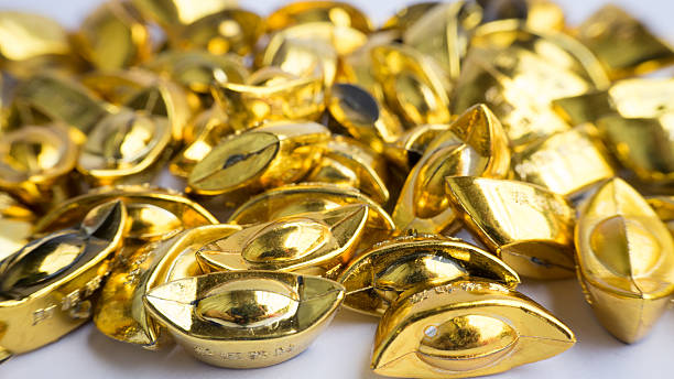 istock Shoe-shaped metal gold ingot (Yuan Bao), China 20th currency 538327363