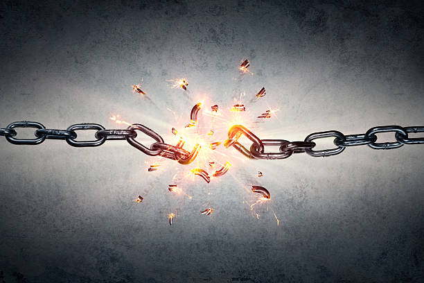 Broken Chain - Freedom Concept chain which breaks under pressure with the back wall breaking stock pictures, royalty-free photos & images