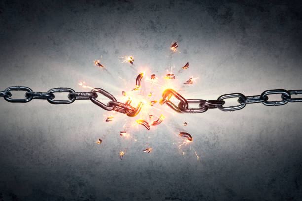 Broken Chain - Freedom Concept chain which breaks under pressure with the back wall breaking free from chains stock pictures, royalty-free photos & images