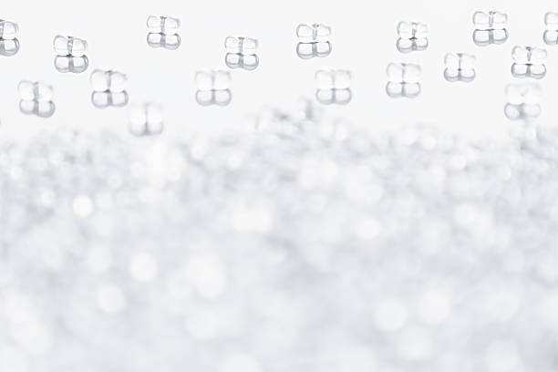 istock Minimalist abstract light background with transparent glass particles. 538328914