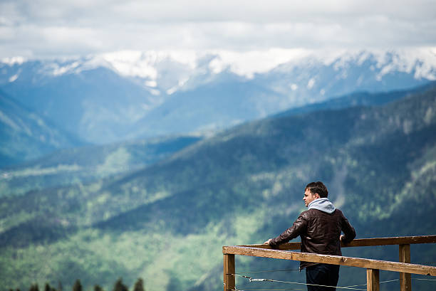 istock Man on a desk in mountains observing the landscape 538329098