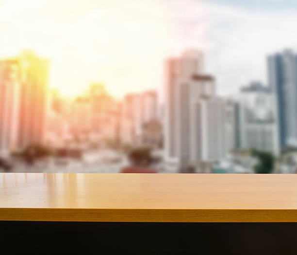 istock wood table on blurred abstract urban background 538330710