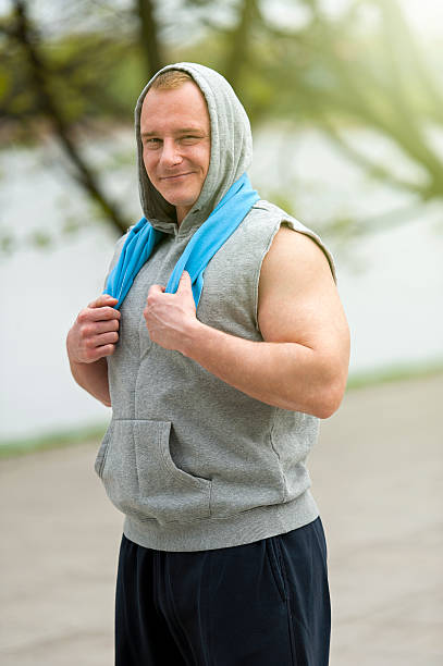 Fit man resting after jogging. stock photo