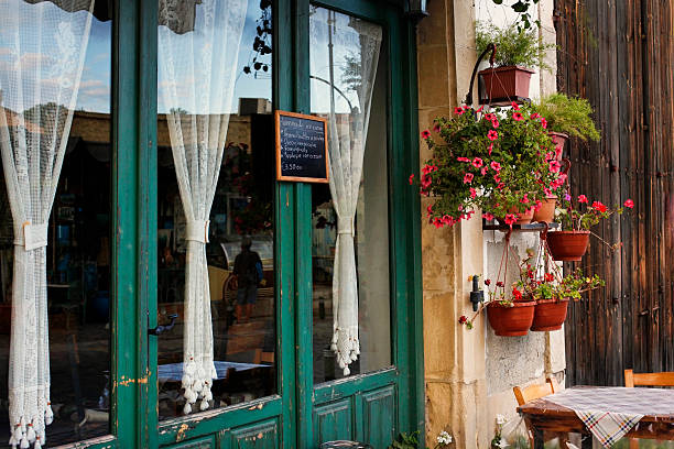 Cafe in Larnaca during Summe Larnaca, Cyprus - May 23, 2016: Small Street with cafe in Larnaca during Summer. Cuprus buzbuzzer quebec city stock pictures, royalty-free photos & images