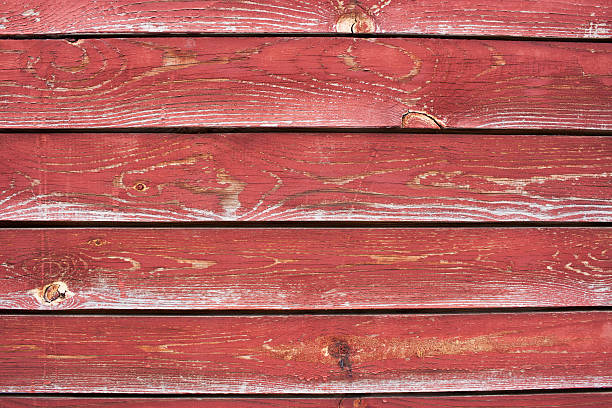 istock A number of  planks with cracked red paint 538332128