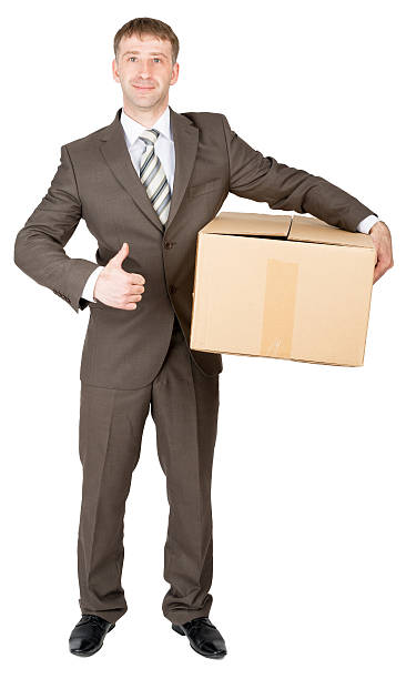 istock Man shows thumbs-up and holds cardboard box 538332542