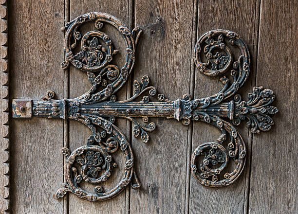 Ornament Door Church Chatellerault Iron ornament on a wooden church door of Chatellerault in France. chatellerault photos stock pictures, royalty-free photos & images