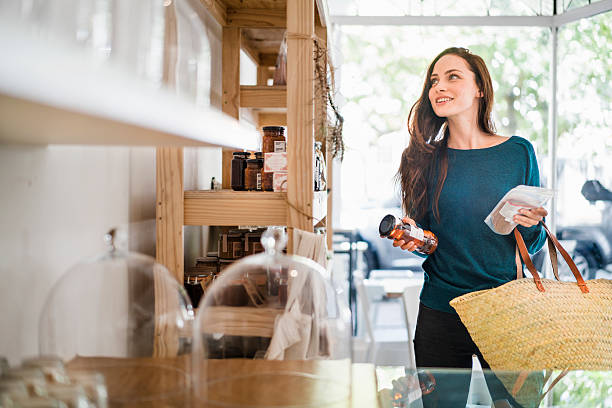 istock Beautiful woman choosing packets in coffee shop 538335676