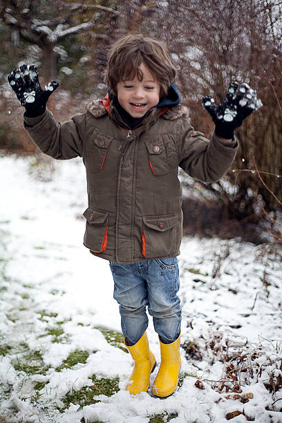 Happy boy in the snow stock photo