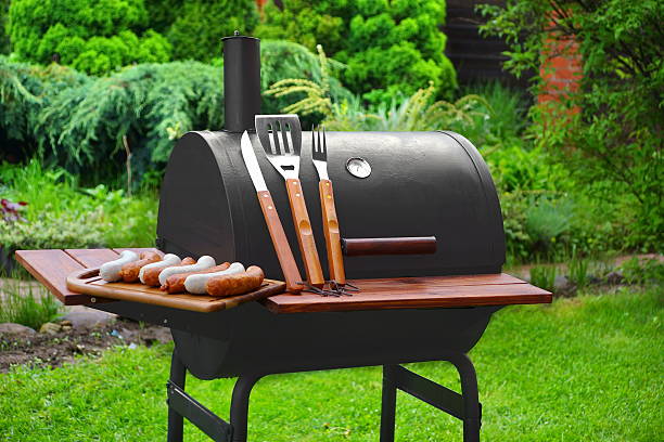 istock Summer Weekend BBQ Scene With Charcoal Grill On The Backyard 538336990