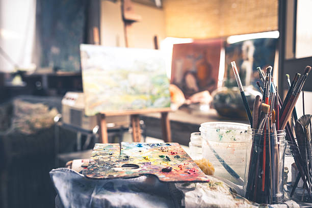 Artist's Palette With Brushes Color palette with brushes in studio artist's oil paint palette stock pictures, royalty-free photos & images