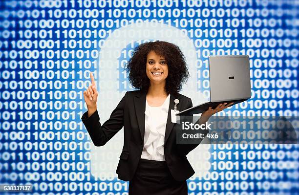 Smiling Businesswoman Holding Laptop Pointing Stock Photo - Download Image Now - African Ethnicity, Businesswoman, Cut Out