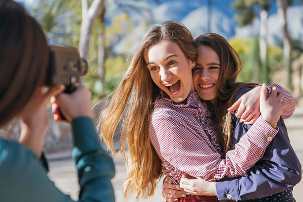 istock Cheerful girl friends posing to camera 538337420