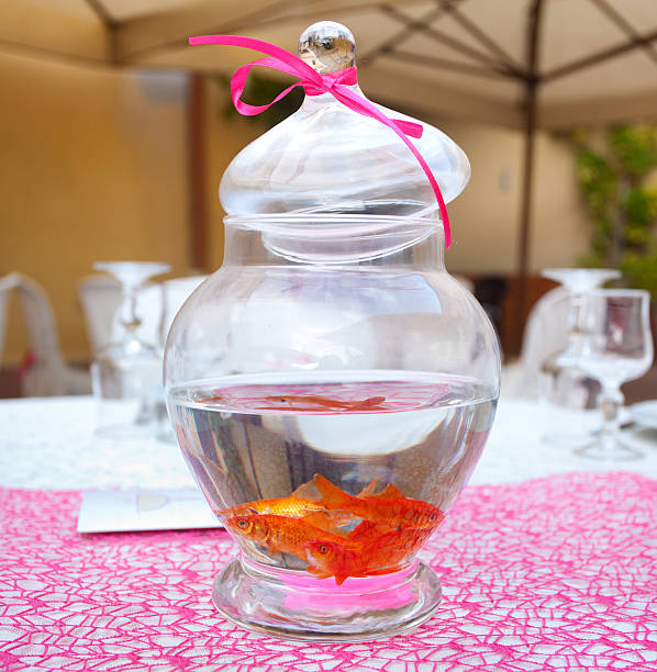 Goldfish in ampule used as centerpieces in a party.