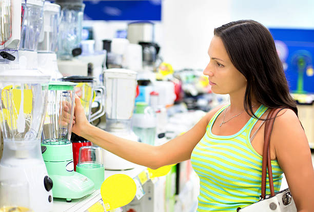 istock woman in a shop buying a blender 538337913