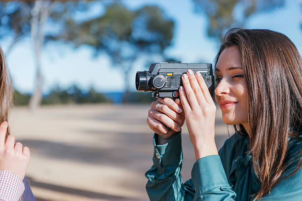 istock Photographer taking shot with vintage camera 538338472