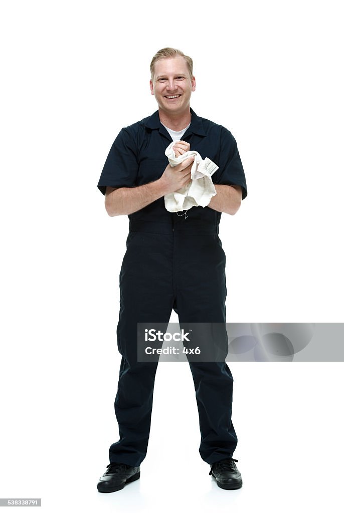 Mechanic standing & laughing Mechanic standing & laughinghttp://www.twodozendesign.info/i/1.png Mechanic Stock Photo