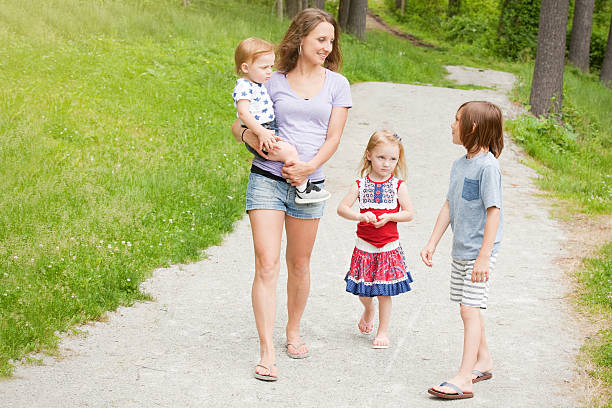 istock Family Walking And Talking In Park 538339818