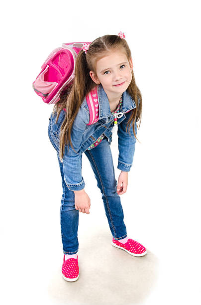 istock Tired schoolgirl with heavy backpack isolated 538341954