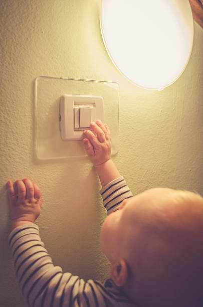 istock Baby child switching on / off the light 538342868