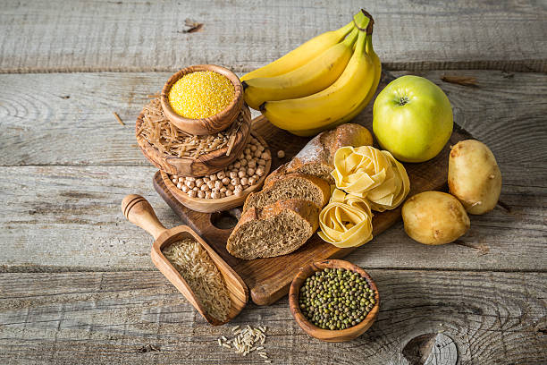 istock Selection of comptex carbohydrates sources on wood background 538342932