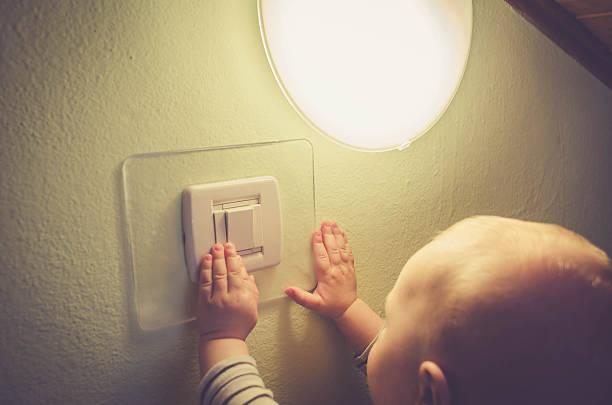 istock Baby child switching on / off the light 538342954