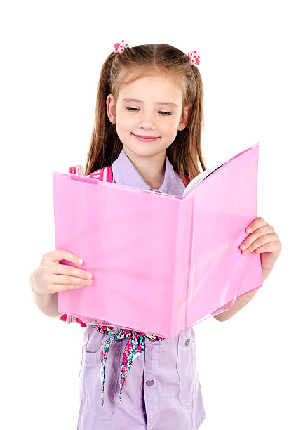 istock Cute smiling schoolgirl with backpack reading the book 538343550