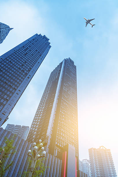 istock airplane flying over skyscraper,chongqing city 538343870
