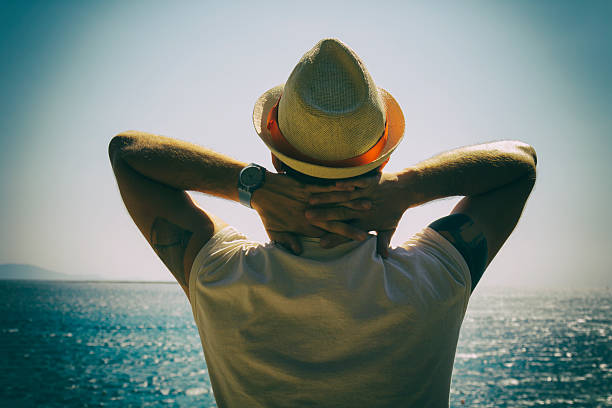 istock Hipster man enjoying on the beach. 538345124
