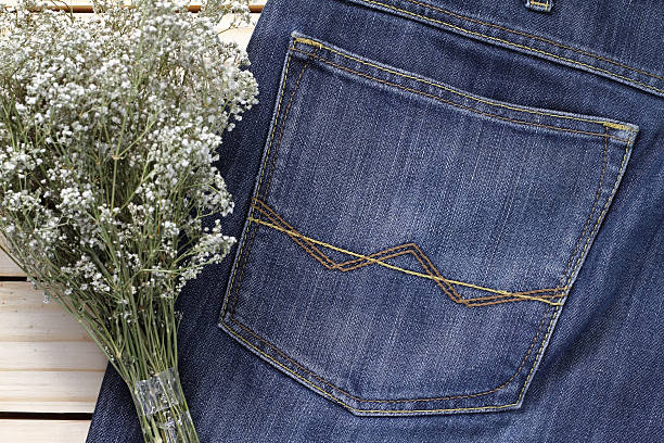 istock dry flowers on jean and wood back ground . 538345892