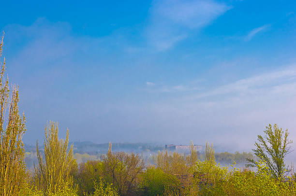 city view in the morning mist in early spring