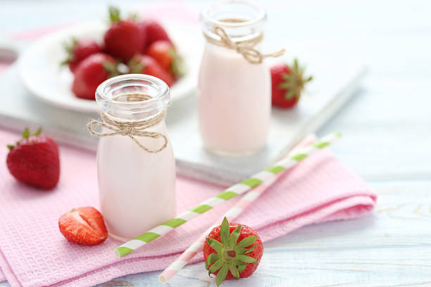 istock Strawberry yogurt in bottle on wooden table 538346120