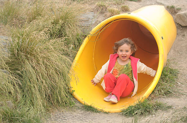 istock Happy girl on slide end 538346268