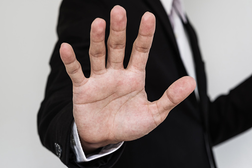 Businessman showing palm hand, Close up hand, denial concept