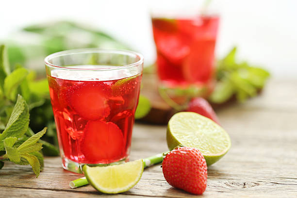 istock Fresh strawberry drink in glass on wooden table 538346946