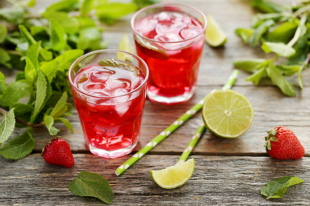 istock Fresh strawberry drink in glass with lime on wooden table 538347080