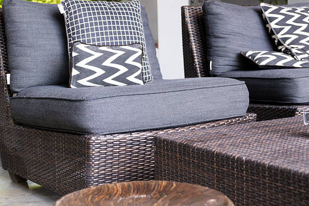 istock black, white cushion and pillow on wicker chair 538349098