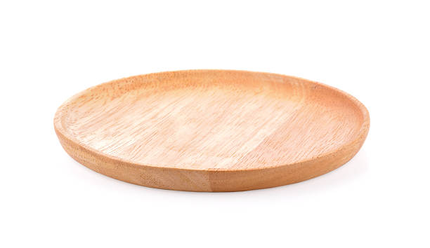istock wooden plate  on white background 538351306
